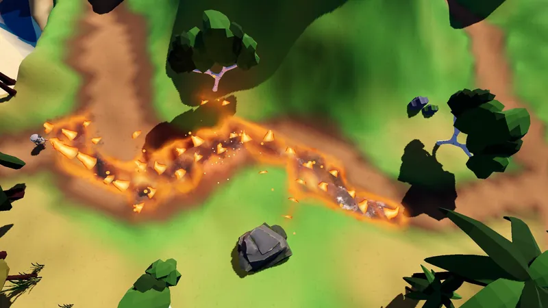 A long winding trail of accelerant bursts into flame across a grassy hillside